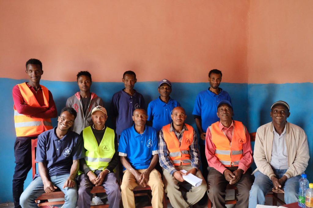 Members of a coffee cooperative gathered for a group photo