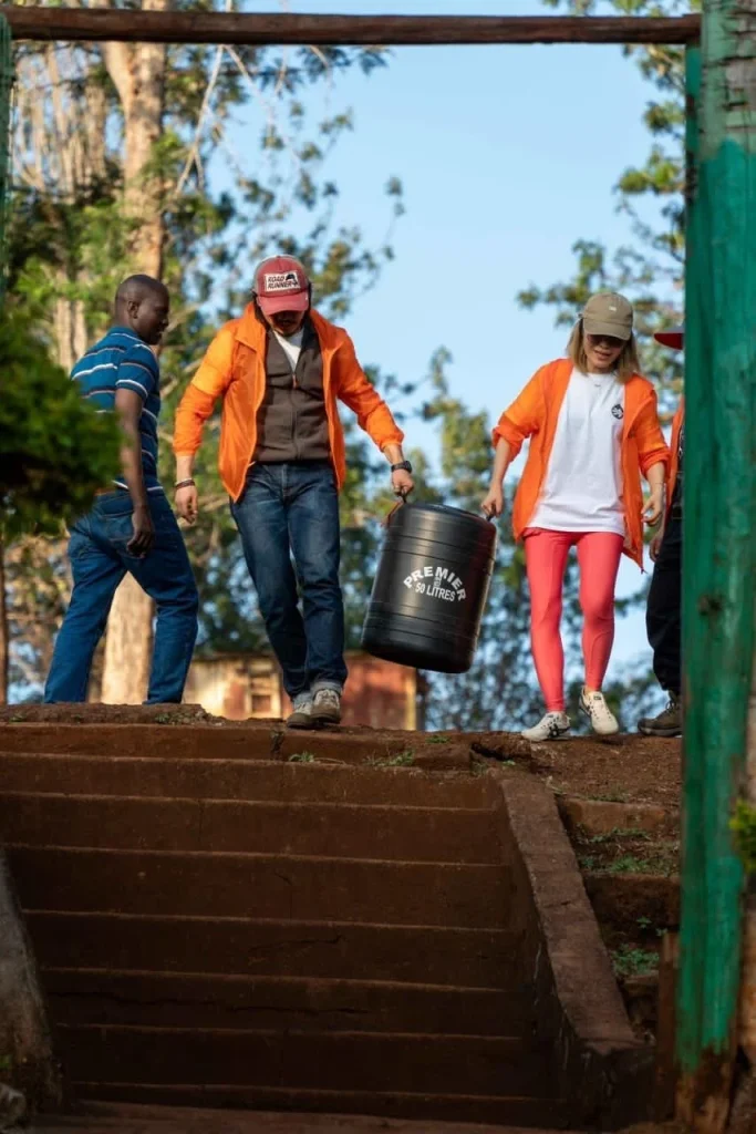 Workers carrying harvested coffee cherries
