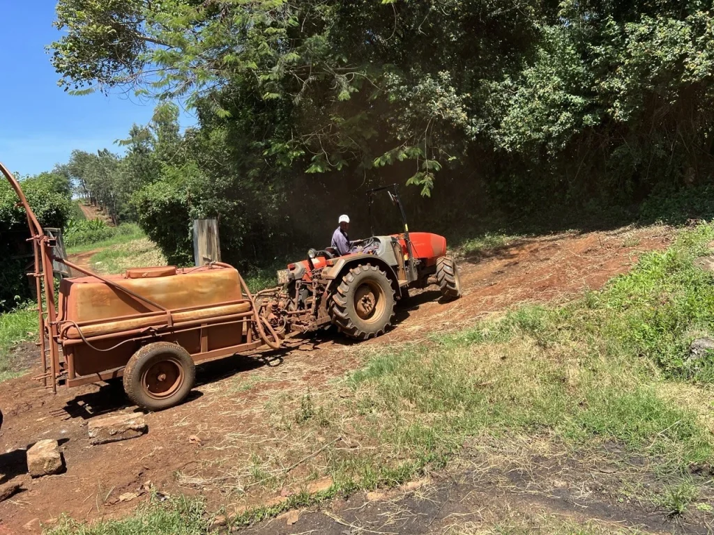 Tractor with sprayer on the coffee farm