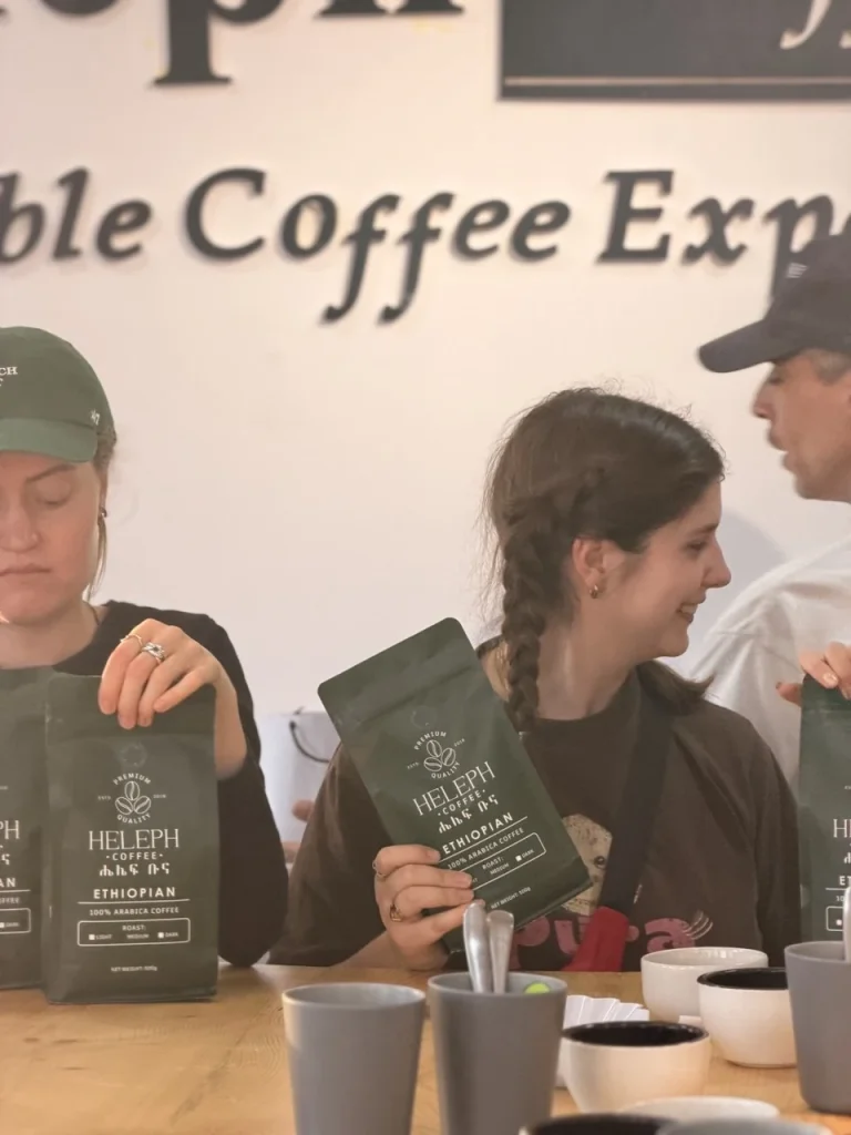Visitors with Heleph coffee bags during a cupping session