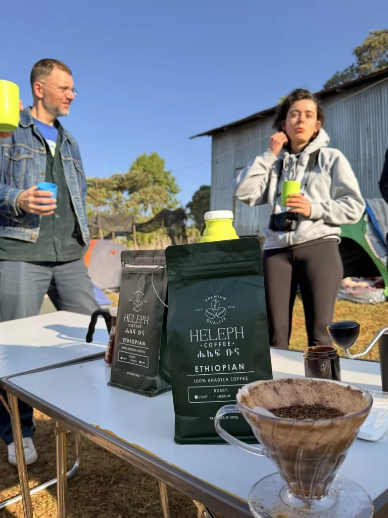 Outdoor coffee tasting table with Heleph bags at origin