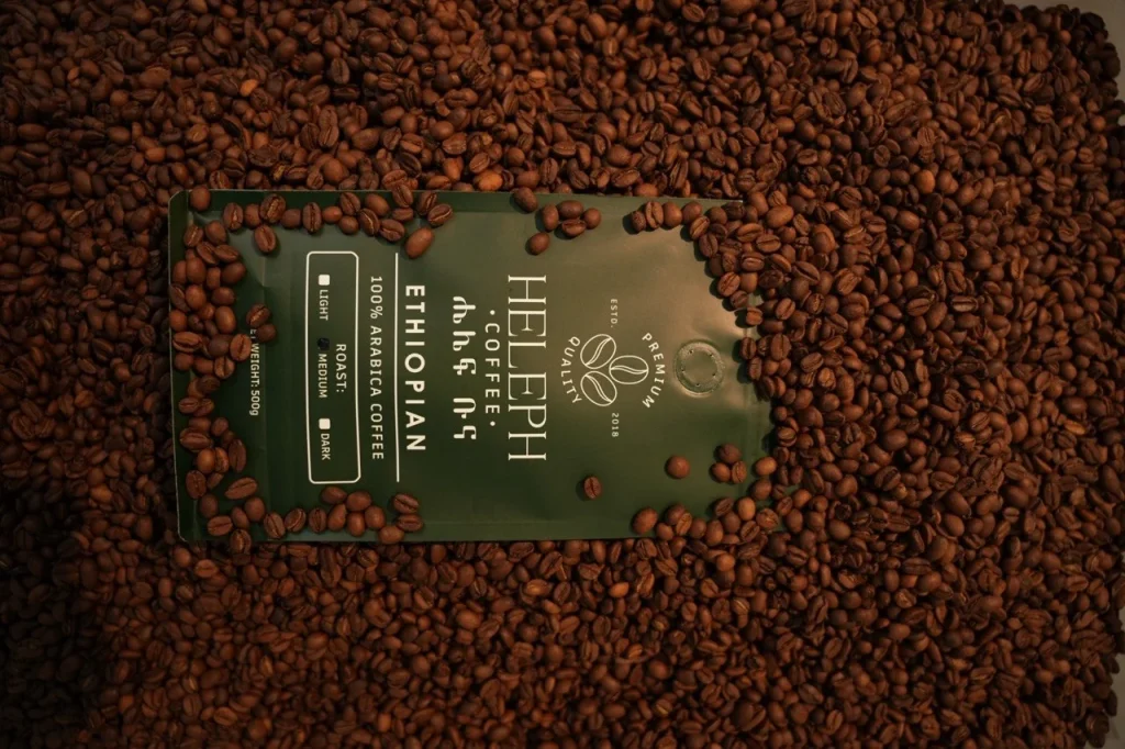 Heleph coffee bag flat lay on roasted coffee beans