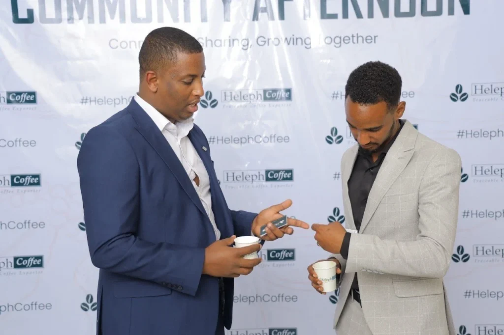 Guests tasting coffee at the Heleph Community Afternoon